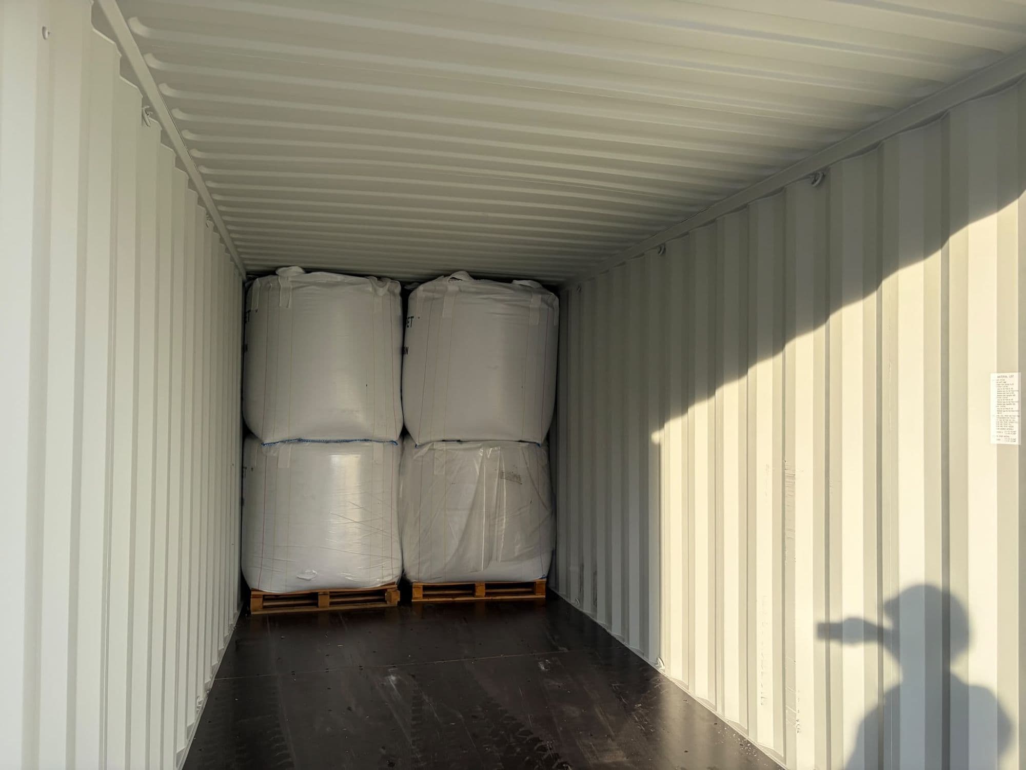 Palletised big bags stowed two high inside the container. The container is confirmed clean and dry before stuffing.