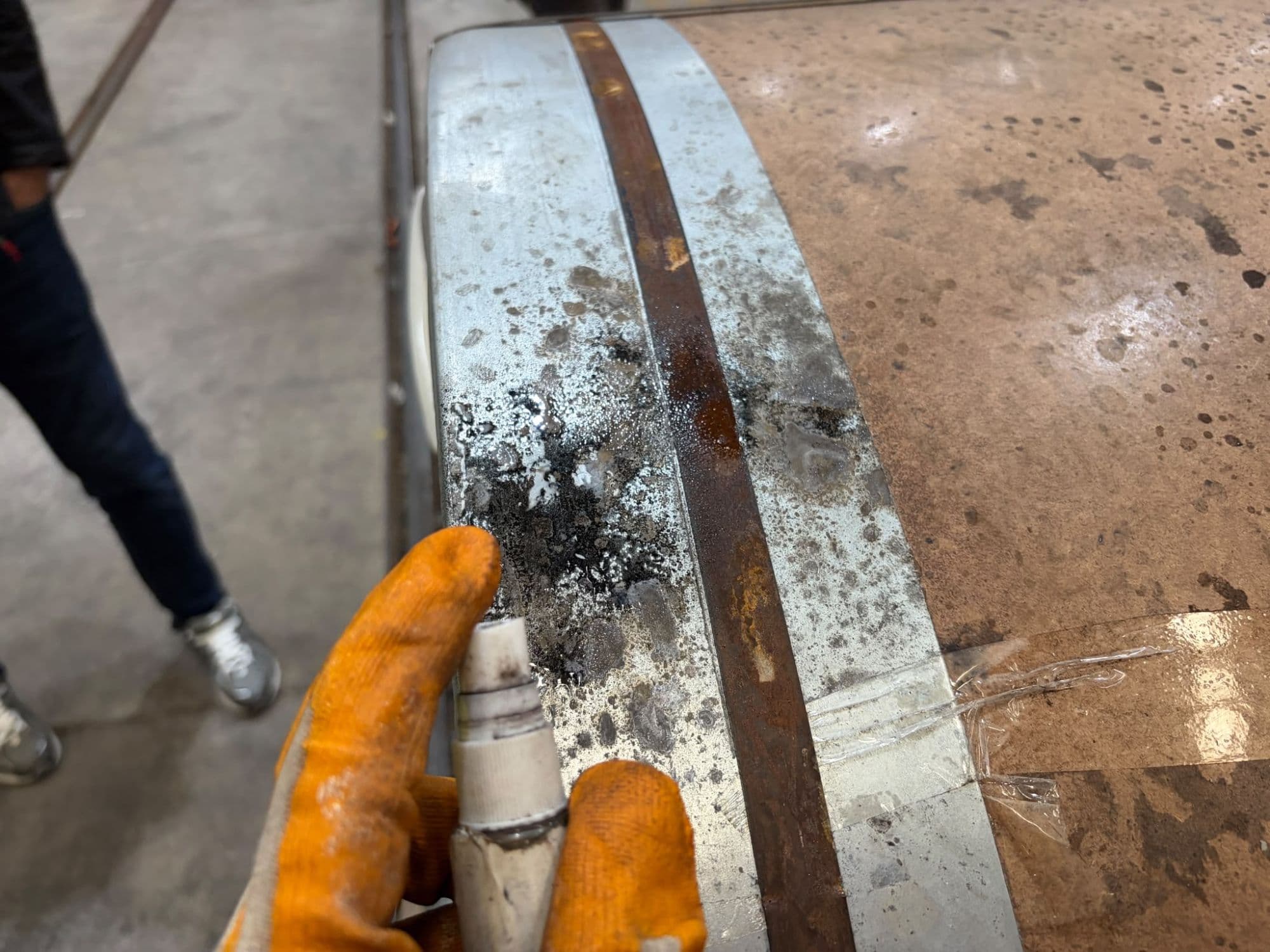 Investigating the source of moisture on a stained coil surface and around a rusted steel band. Band areas are where water collects most and receive particular attention.